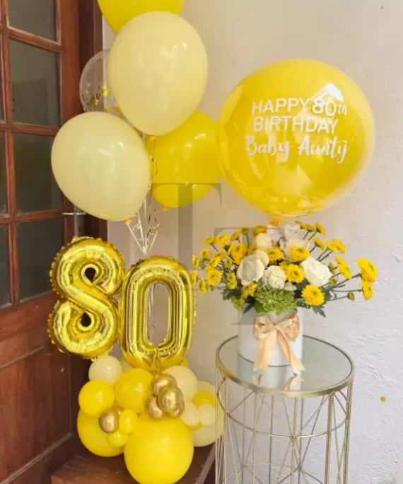 yellow balloons and flower bundle